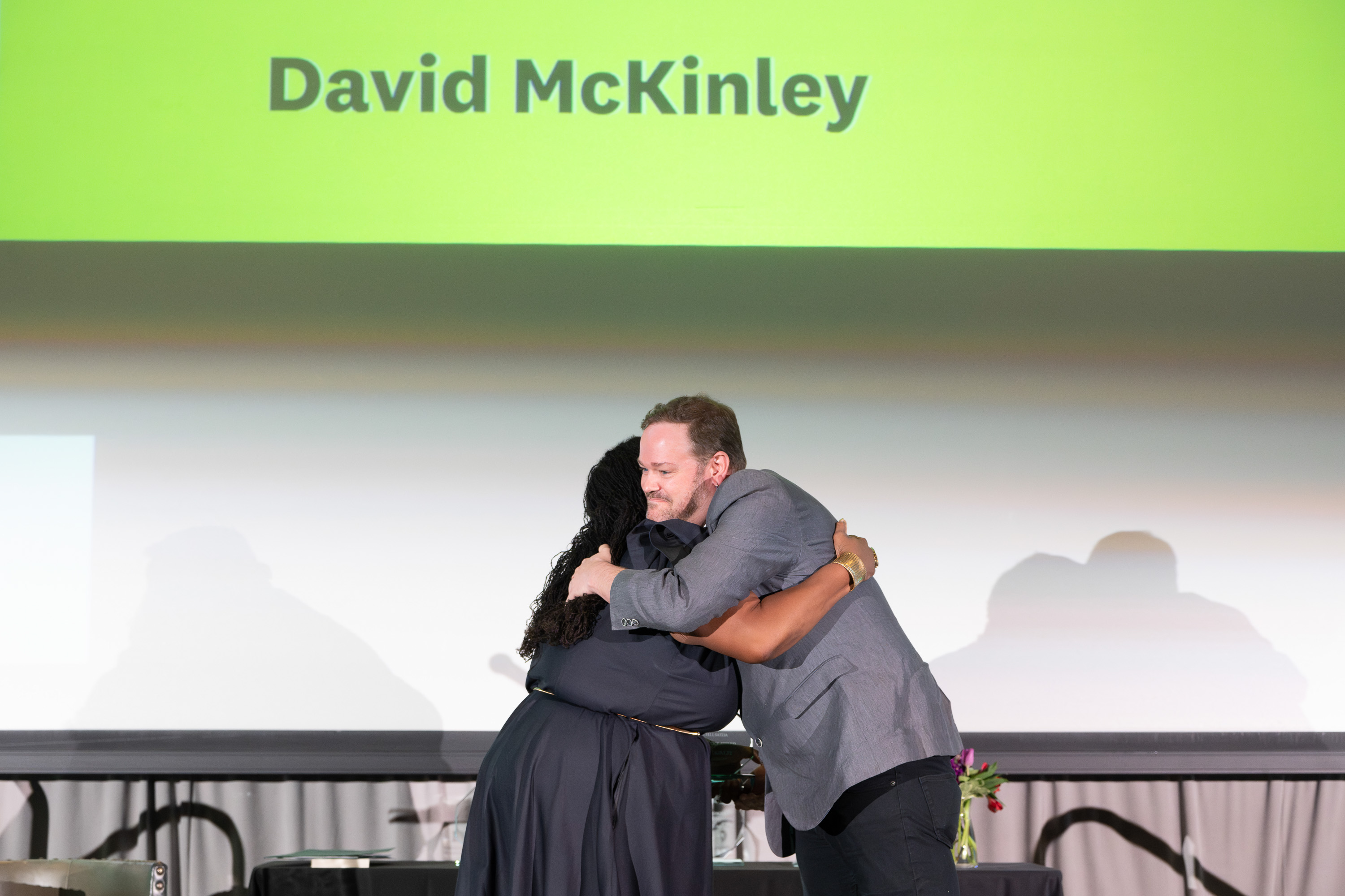 David McKinley accepting an award from Shontay Delalue