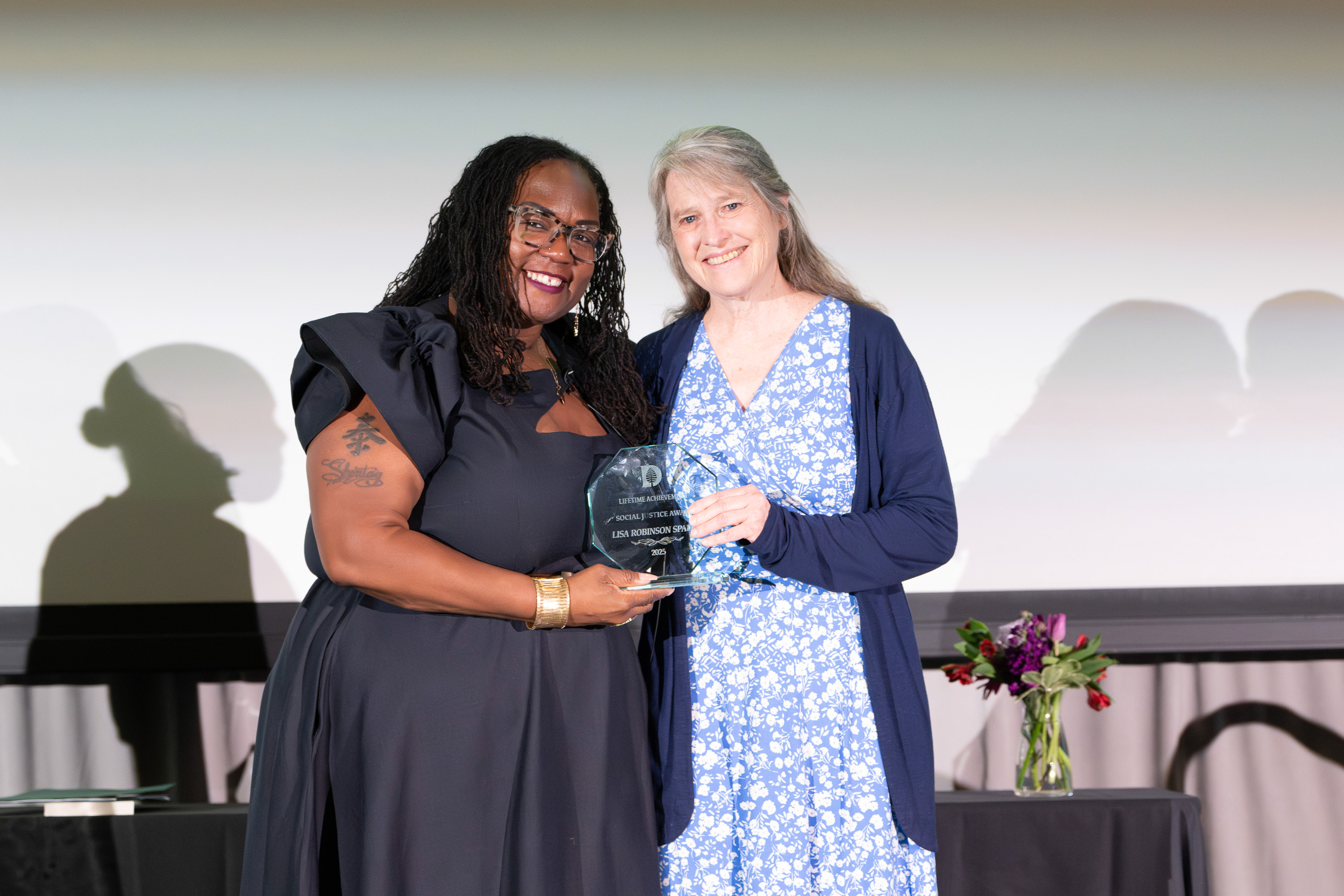 Lisa Robinson Spader accepting an award from Shontay Delalue