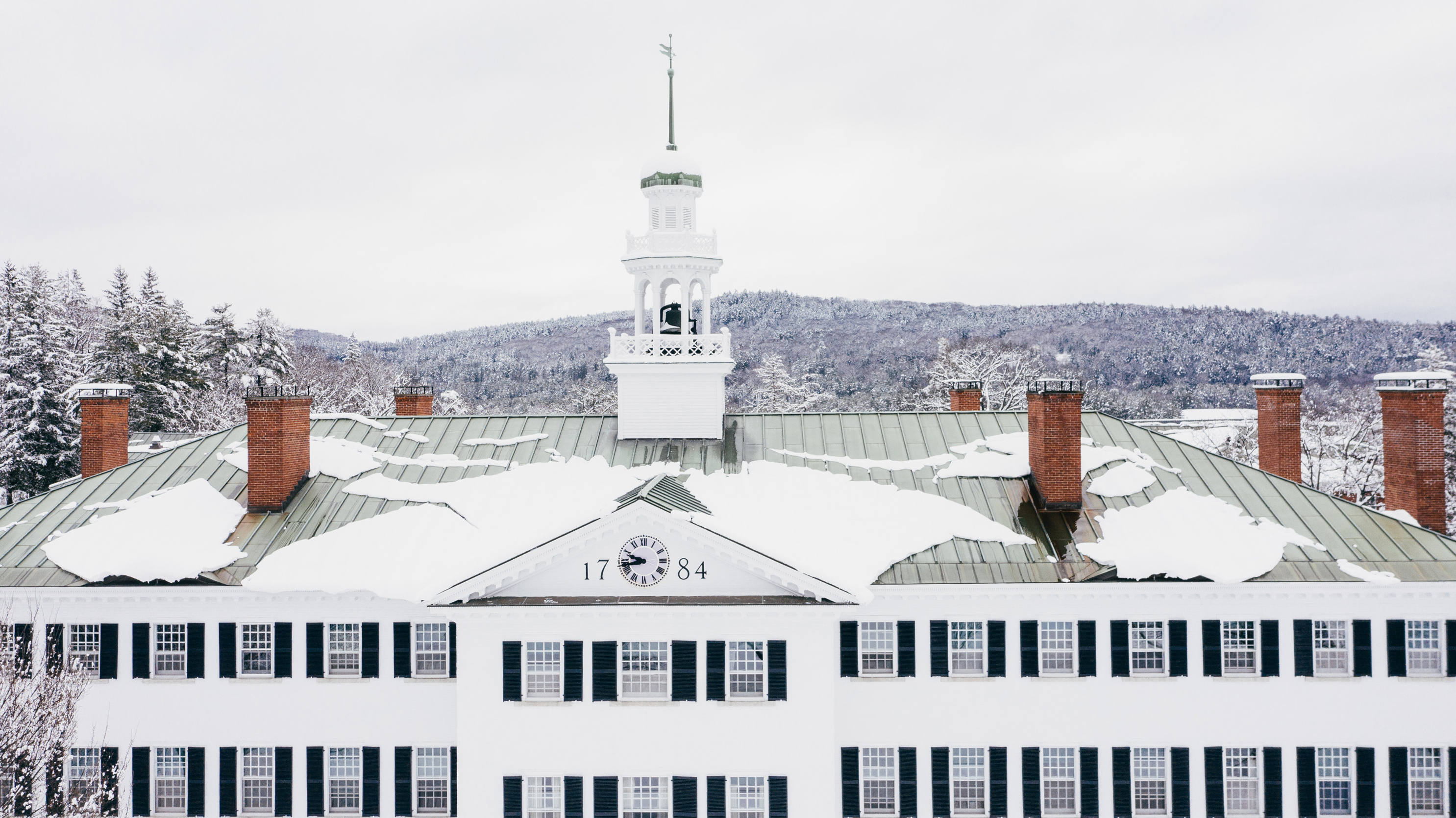 Snowy rooftop and cupola of Dartmouth Hall