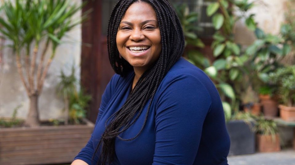 Portrait of Chloe Poston in a dark blue shirt