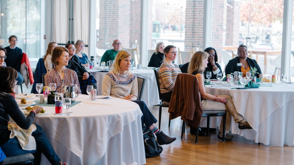 Audience members listen to a speaker at the 2023 Inclusion Champions program.